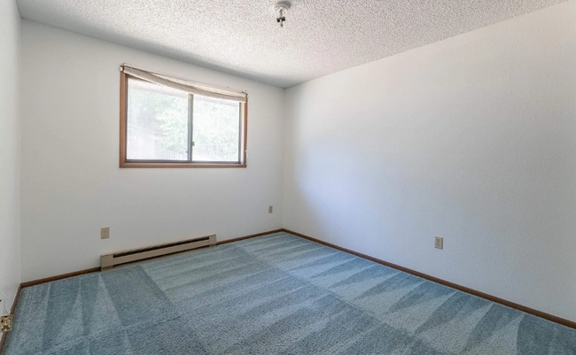 Building Photo - Three bedroom two bath home in a quiet nei...
