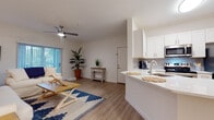 Located at 1114 S Missouri Ave in Clearwater, Florida, this single-floor residence offers a cohesive coastal aesthetic complemented by clean, modern finishes. Light wood-style flooring flows throughout the entire unit, creating a warm and unified foundation for each space.

The living area is generously proportioned, featuring a ceiling fan, vertical blind-covered sliding glass door that invites natural light, and ample room for multiple seating arrangements. Its open connection to the kitchen enhances the sense of spaciousness. The kitchen is well-equipped with white shaker cabinetry, a light quartz peninsula countertop, tile backsplash, and stainless steel appliances including a range, microwave, and refrigerator. An adjacent dining nook with chair rail detailing provides an intimate setting for meals.

The bedroom is a calm retreat, benefiting from a large window that fills the room with natural light. The bathroom features a clean, grey vanity with a wide mirror, light countertops, and a shower-tub combination. Throughout the unit, white walls and neutral tones contribute to an airy, relaxed atmosphere well-suited to the Clearwater coastal environment.