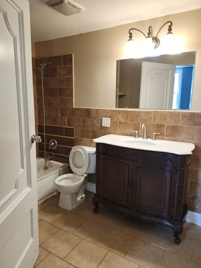 Downstairs full bath - 404 W Courtois St