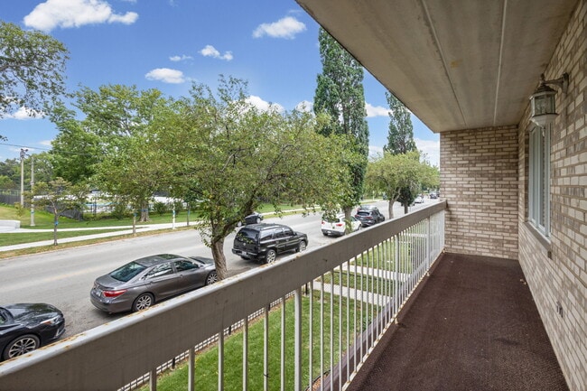 Spacious balcony overlooking wenworth park and ice rink - 5632 S Narragansett Ave