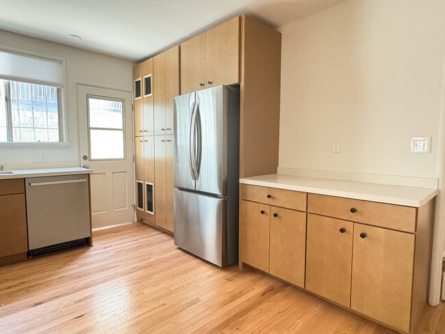 Kitchen with brand new stainless steel appliances, quartz countertops, and maple cabinets - 1041 Wilcox Ave