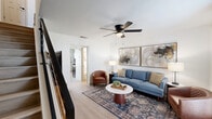 Located at 4201 William Fleming in Fort Worth, TX, this two-story, 2-bedroom, 2-bathroom home offers a practical and stylish layout spread across two floors. Light wood-style flooring runs throughout, creating a cohesive and airy feel in every room.

The main floor hosts the living room, dining area, and kitchen. The living room is bright and inviting, featuring a ceiling fan with light fixture and open access to the rest of the home via a staircase. The kitchen is well-equipped with taupe cabinetry, a white subway tile backsplash, light countertops, a stainless steel dishwasher, and a double sink — all finished in a clean, modern palette. The adjacent dining area is highlighted by a full wall of built-in cabinetry with open shelving, offering generous storage and display space alongside a window that lets in natural light. A laundry area is also found on this level.

Upstairs, both bedrooms are comfortably sized, each with ceiling fans and closets. The primary bedroom features a window with natural light and ample space. The hallway connecting the upper rooms adds to the efficient flow of the floor plan. Two full bathrooms and three closets round out the home's practical offerings, making this a well-organized and move-in-ready residence.