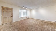 Located in the desirable West Los Angeles neighborhood of 90025, this 2-bedroom, 2-bathroom home offers a practical and well-organized single-floor layout. The living area features neutral-toned carpeting throughout, a textured ceiling, and track lighting that provides flexible illumination across the open space. A wall-mounted A/C unit and large windows with blinds allow for natural light and climate control.

The kitchen is efficiently designed with white cabinetry, granite-style countertops, a double stainless steel sink, and a full suite of stainless steel appliances including a gas range, built-in microwave, and refrigerator. Tile flooring completes the clean, functional aesthetic.

Both bedrooms are carpeted and bright, with windows offering natural light. The primary bedroom includes a ceiling fan with integrated lighting, while both rooms feature dedicated closet space for ample storage.

The two bathrooms are finished with light tile flooring and marble-style countertops. Each includes a vanity with white cabinetry and a mirrored medicine cabinet. One bathroom features a tub-shower combination enclosed by sliding frosted glass doors with classic white tile surround. A hallway connects the rooms, adding to the home's cohesive and efficient flow.