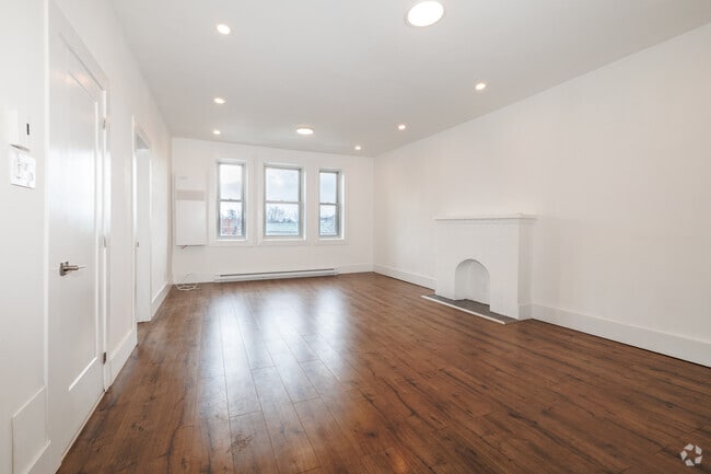 3BR, 2BA - 1350SF - Living Room - Plaza Court