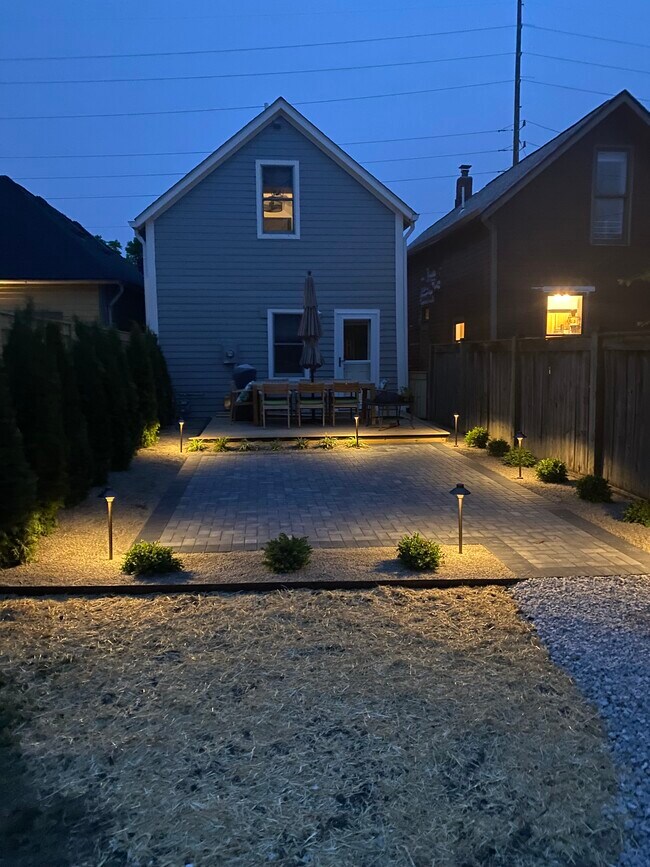 backyard of house in the evening... lights stay - 605 Lord St