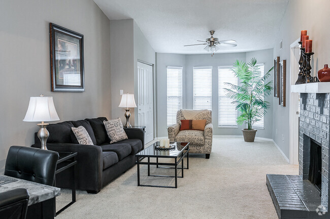 Wood Burning Fireplace and Large Windows in Living Room - Willowbend