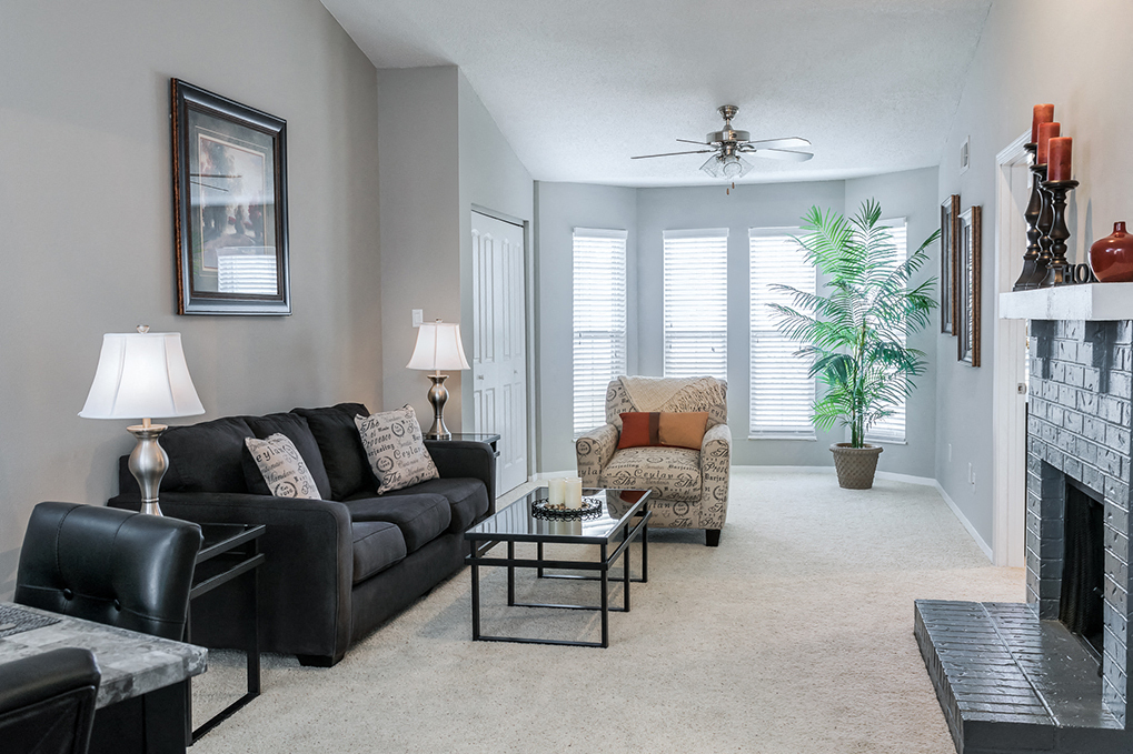 Wood Burning Fireplace and Large Windows in Living Room - Willowbend