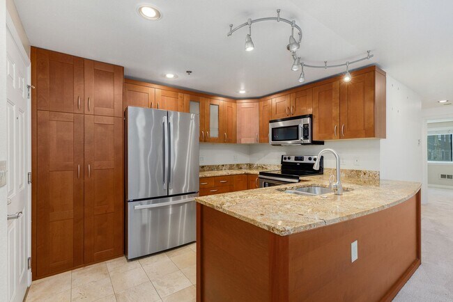 Building Photo - Updated Cap Hill Bedroom with 1 reserved p...
