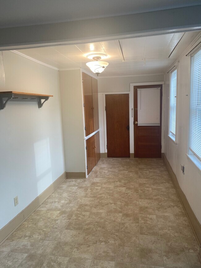 Kitchen facing entry door - 168 Hudson Ave