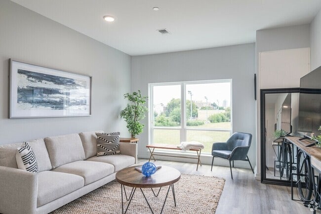 Sun-soaked living room windows - The Parkside Fishtown Apartments