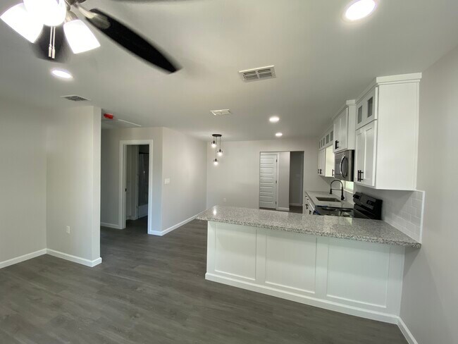 Open concept kitchen custom cabinets and bar - 1209 Perkins Ave