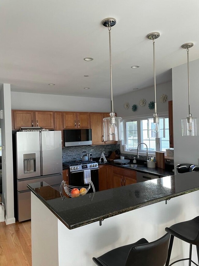 Kitchen with updated GE Cafe appliances - 61 Woodview Way