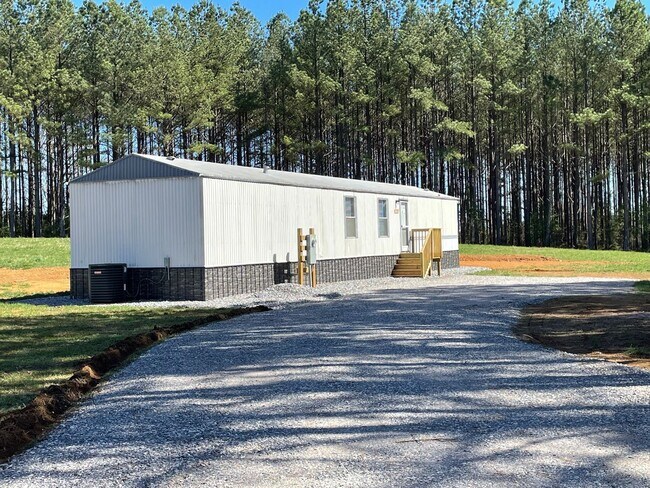 Building Photo - 3 BED 2 BATH MOBILE HOME IN GATED COUNTRY SETTING LOCATED IN DENTON AREA