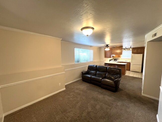 Living room with large side window to the east (sofa may be available) - 1070 S Orem Blvd