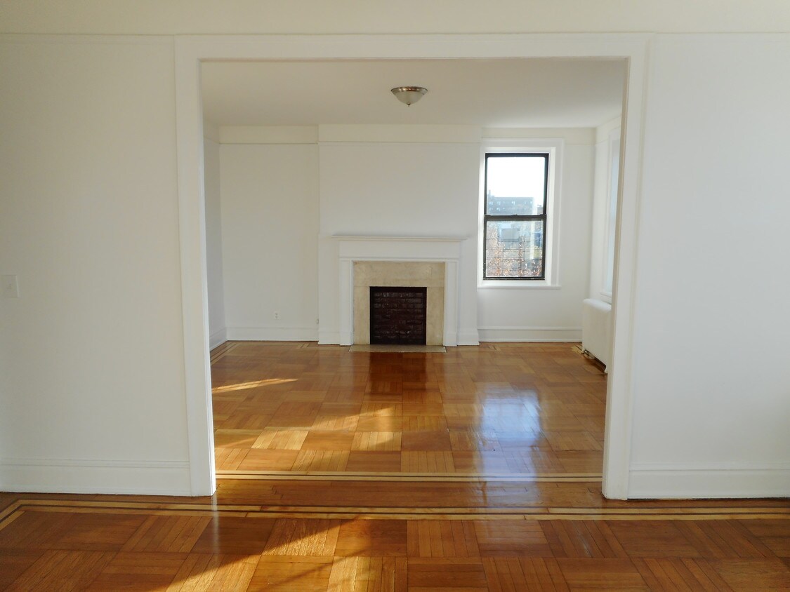 living room with fireplace - 37-15 79th St