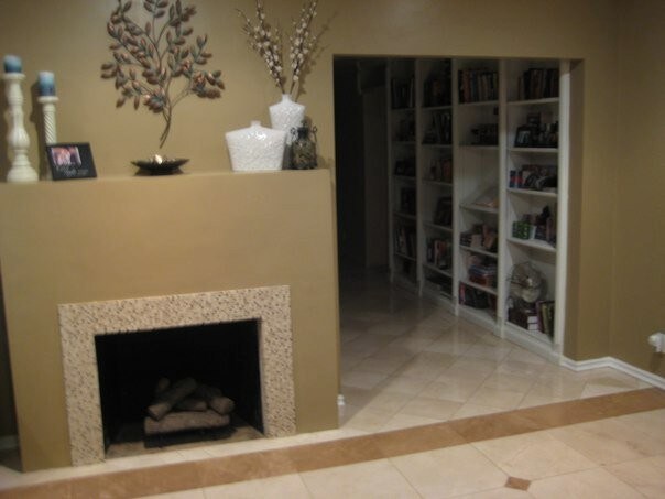 Living Room Fireplace leads to hallway with builtin Library shelves - 720 N Workman St