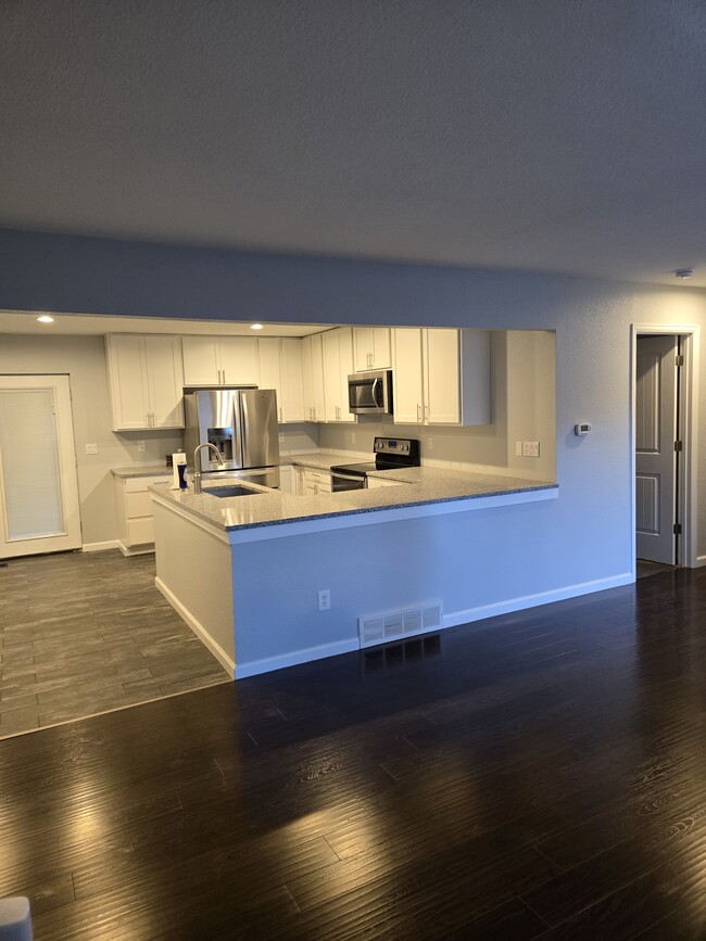 Kitchen open to Living Room - 8731 Field Way