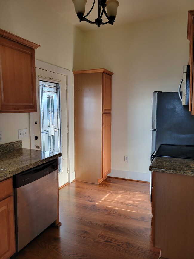 Kitchen view with pantry, refrigerator and stove - 1017 11th St