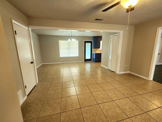 Living room/dining area. - 1727 Austin St