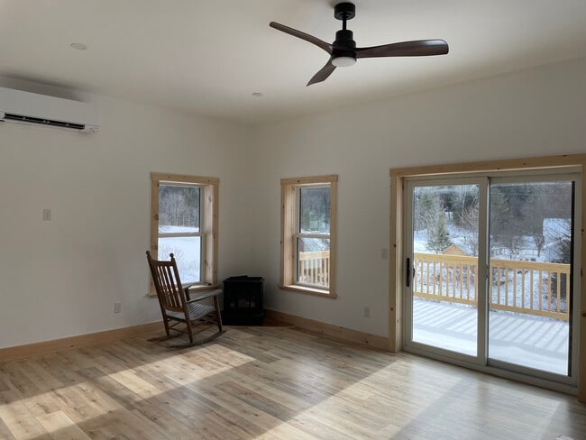 Living room to large south-facing deck - 223 Huntley Rd
