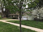 Stone facade front with attached garage and newly-installed, energy-efficient roof - 325 N Rutland Ave