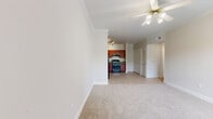 Located at 5950 Antoine Dr in Houston, TX, this one-bedroom, one-bathroom unit offers a thoughtfully designed single-floor layout. Crown molding throughout lends a refined architectural touch, unifying each room with a clean, polished aesthetic.

The kitchen is a functional highlight, featuring rich cherry wood cabinetry, granite countertops, light tile flooring, and a full suite of black appliances including a refrigerator, range, and dishwasher. Ample upper and lower cabinet storage makes this kitchen as practical as it is attractive. A decorative column accent adds a subtle architectural detail at the kitchen's edge, adjacent to a spacious closet.

The bedroom is comfortably sized, finished with soft wall-to-wall carpeting, crown molding, and a ceiling fan for year-round comfort. A window allows in natural light with views of outdoor greenery, creating a calm and pleasant atmosphere.

The bathroom is well-equipped with a tub-shower combination, a cherry wood vanity topped with granite, matching wall-mounted cabinetry for additional storage, and clean tile flooring. The consistent use of warm wood tones and granite surfaces ties the bathroom to the overall design language of the space.

A hallway and dedicated closet complete this efficiently planned layout, making it a practical and inviting home.