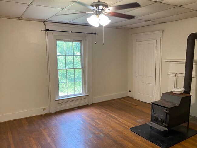 17' by 17' Master Bedroom with wood stove - 102 Alpine Rd