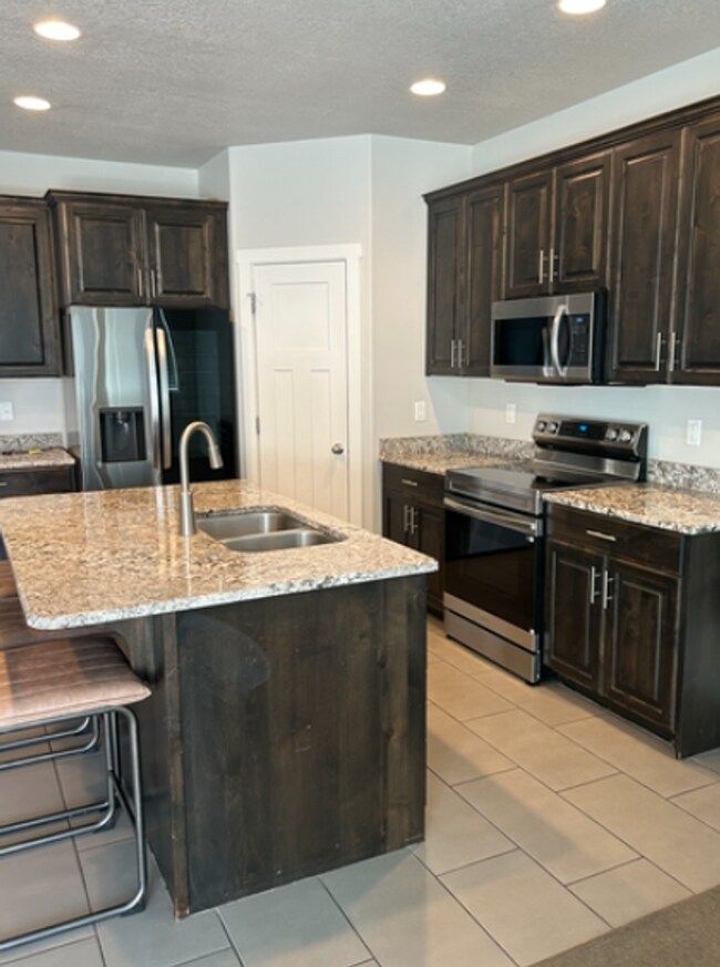 Foto del edificio - Stylish 3-Bedroom Townhome in Traverse Mou...