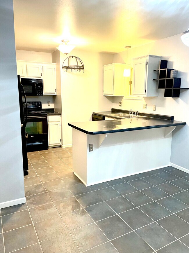 Kitchen with microwave/hood, range, dishwasher - 469 Center St