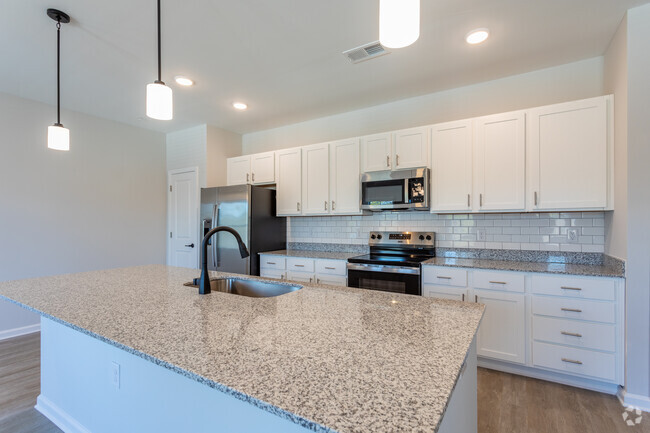 3BR, 2BA - 1,565SF - Kitchen - Waterford Apartments