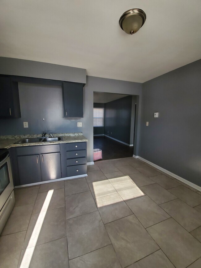 KITCHEN WITH OPENING TO LIVING ROOM - 1007 29th St