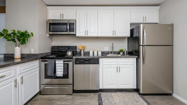 Level up your college life in our fully equipped kitchen with stainless steel appliances - a stylish hub for sharing culinary adventures with roommates. - Alpine Commons