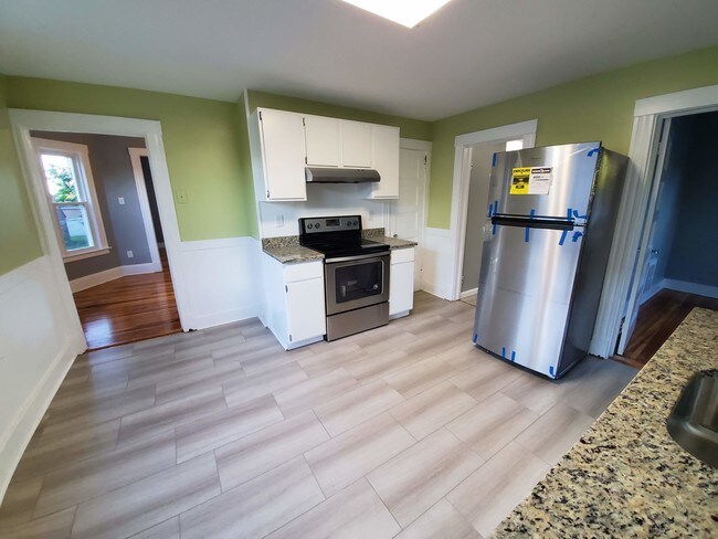 Kitchen with granite counters and stainless s - 76 Summer St