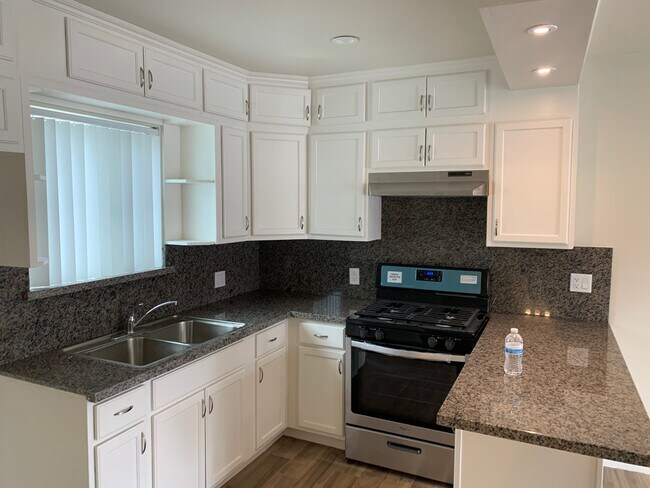 kitchen open with bar dining - 24441 University Ave