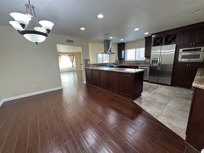 Dining area & kitchen looking to living room - 11008 Twin Pond Ter