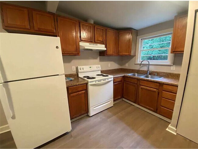 Updated kitcen with new countertops and refrigerator - 112 NE 20th St