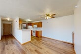 Located at 1604 Grandview Ave in Papillion, Nebraska, this single-floor, 2-bedroom, 2-bathroom home offers a comfortable and functional layout. The open-concept living and dining area flows seamlessly into the kitchen, creating an inviting shared space ideal for everyday living. The living room is highlighted by a corner fireplace with warm wood trim and a sliding glass door that fills the room with natural light and provides direct access to a private patio.

The kitchen features warm oak cabinetry, light countertops, white appliances including a refrigerator, range, microwave, and dishwasher, and a peninsula for additional prep space. A convenient in-unit laundry area is accessible directly from the kitchen. Light wood-style flooring runs throughout the main living areas, while the bedrooms are carpeted for added comfort.

The spacious primary bedroom includes two generously sized closets with bi-fold doors and connects to a private bathroom featuring a walk-in shower. A second full bathroom with a tub/shower combination serves the additional bedroom. Three total closets throughout the home offer ample storage. The well-lit hallway with textured ceilings and classic trim detailing ties the space together with a clean, neutral aesthetic throughout.
