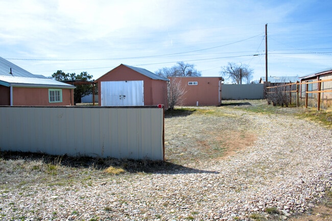 Gravel 'road' to the rear, storage shed, studio behind it (unavailable) - 301 Sunset Ave N