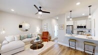 Located on Lime Quarry Road in Madison, Alabama, this thoughtfully designed one-bedroom, one-bathroom unit maximizes its compact footprint through an efficient open-concept layout. Warm wood-look flooring and soft neutral wall tones run consistently throughout, creating a cohesive and inviting atmosphere.

The living room is bright and airy, featuring a ceiling fan with light fixture, recessed lighting, and multiple windows dressed with sheer curtains that allow natural light to fill the space. The area flows directly into the kitchen, which is appointed with white shaker-style cabinetry, light quartz countertops, stainless steel appliances including a refrigerator and range, a double-basin sink with a matte black faucet, and pendant lighting above a breakfast bar.

The bedroom comfortably accommodates a full-size bed, includes a ceiling fan, recessed lighting, and a window for natural light. A dedicated laundry room off the bedroom houses a stacked washer and dryer alongside built-in wire shelving, doubling as additional storage.

The bathroom features a long white vanity with ample cabinet storage, a light quartz countertop, wood-look flooring, and gold-framed wall mirrors, combining functionality with a clean, modern aesthetic.
