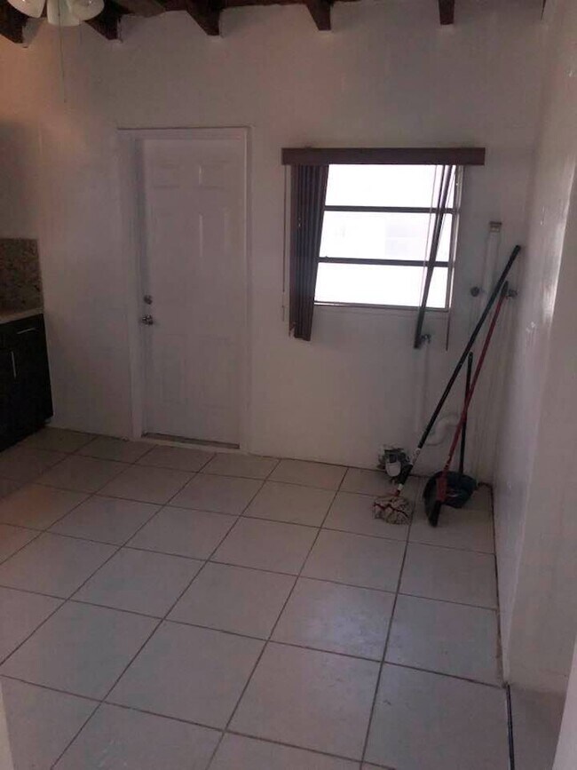 Kitchen (will include a new washer and dryer and refrigerator upon move in). - 6811 NW 6th Ave