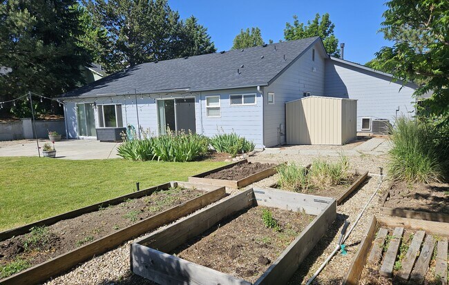 back yard with garden and flowers - 6488 S Honeylocust Pl