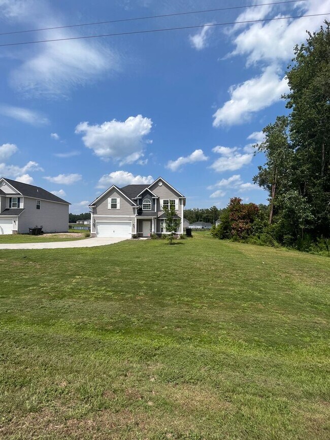 Building Photo - Spacious 4-Bedroom Pet Friendly Home with a Serene View - Available for Rent!