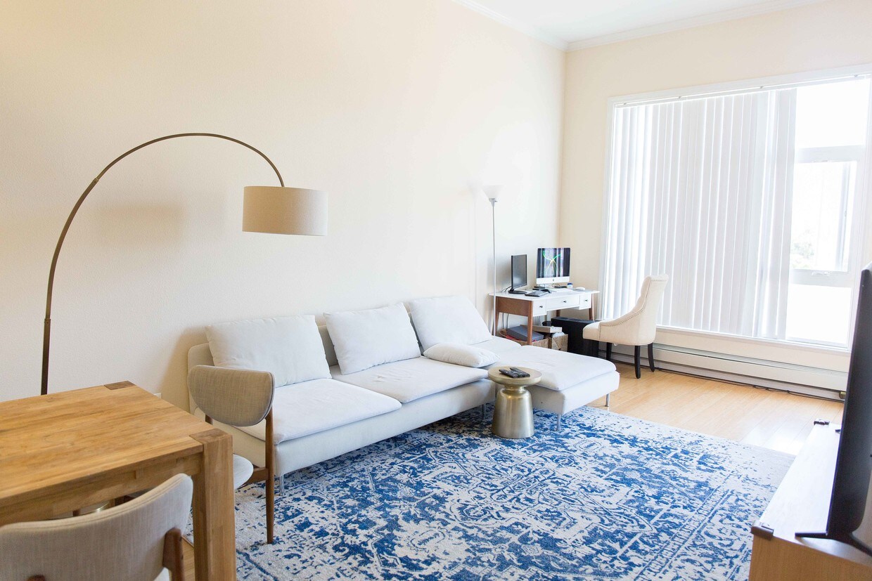 Living Room with High Ceilings - 15956 E 14th St