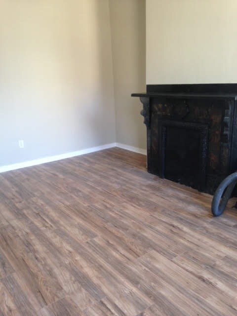 Living room with original fireplace (non-working) - 1206 Middle St
