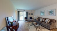 Located at 20 Church Rd in Maple Shade, NJ, this single-floor residence offers a well-organized and comfortable layout across several distinct living areas. The generously sized living room is a central highlight, featuring plush wall-to-wall carpeting, neutral-toned walls, and large sliding glass doors that open to a private balcony, flooding the space with abundant natural light and providing pleasant outdoor views. The room comfortably accommodates multiple seating arrangements, making it ideal for both relaxing and entertaining.

The primary bedroom is notably spacious, complete with carpeted floors, a sliding-door closet, and a direct en-suite bathroom connection. The second bedroom offers ample room for a bed and a dedicated workspace, along with its own closet and a window that brings in natural light. The full bathroom features classic pink tile work on both the floor and lower walls, a shower-tub combination, and a wood-toned vanity.

The kitchen is equipped with light wood cabinetry, speckled laminate countertops, and a stainless steel sink, providing functional storage and prep space. Adjacent to the kitchen, a cozy dining area with cork-style flooring and a bright window serves as an inviting space for meals. Throughout, the residence maintains a clean, consistent aesthetic with warm, neutral tones.