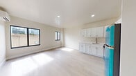 Located at 437 SW Sixth St in Miami's vibrant Brickell neighborhood, this one-bedroom, one-bathroom unit offers a well-designed layout with a clean, modern aesthetic throughout. Light wood-style flooring flows seamlessly across the entire space, complementing the crisp white walls and abundant natural light that pours in through large black-framed windows.

The kitchen is a standout feature, showcasing white shaker cabinetry, light countertops, and a striking set of turquoise appliances — including a refrigerator, gas range, and over-the-range microwave — that serve as a bold design focal point against the otherwise neutral palette.

The spacious bedroom offers generous storage through dual louvered bifold closets spanning nearly an entire wall, alongside a wall-mounted mini-split air conditioning unit for individualized climate control. Windows frame views of the surrounding neighborhood, filling the room with natural light.

The bathroom is finished with elegant marble-look tile covering both the floors and walls, creating a cohesive, upscale feel. A white vanity with a framed mirror and chrome fixtures completes the space.

Overall, this unit combines practical design with distinctive details, offering a bright and functional living environment in one of Miami's most sought-after urban neighborhoods.