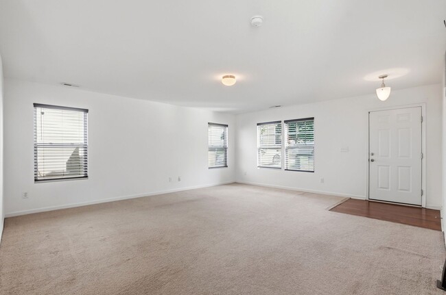 Building Photo - Spacious 4BR Home with New Carpet & Fenced Backyard