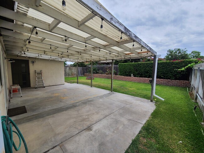 Backyard with firepit and huge covered patio - 10191 Eagle Rock Ave