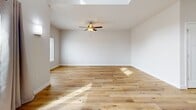 This well-designed 1970 square foot home in Fitchburg, WI offers a blend of comfort and functionality across two floors. The property features 3 bedrooms, including a sizeable 170 square foot primary bedroom, and 4 bathrooms, providing ample space for family living or entertaining guests.

The modern kitchen is a highlight, boasting taupe cabinetry, stainless steel appliances, and a white quartz island with a sink, perfect for food preparation and casual dining. The living areas showcase beautiful hardwood flooring, while bedrooms are fitted with plush carpeting for comfort.

Throughout the home, large windows allow natural light to flood the spaces, creating a bright and inviting atmosphere. Ceiling fans in several rooms provide additional comfort and air circulation. The bathrooms feature a clean, contemporary design with wood-look flooring and white fixtures.

The laundry room is conveniently located within the home, equipped with full-sized appliances. The property also includes two closets and two hallways, enhancing storage and flow. With a total of 1090 square feet on the upper floor and 890 square feet on the ground floor, this home offers a well-balanced living space that caters to various lifestyle needs.