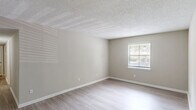 Located at 800 State St in West Columbia, SC, this single-story, 3-bedroom, 2-bathroom home offers a clean, functional layout designed for comfortable everyday living. Throughout the home, light wood-style flooring and neutral beige walls create a cohesive, understated aesthetic complemented by white trim and textured ceilings.

The living room provides a welcoming common area, while the adjacent dining room features a pendant light fixture and large sliding glass doors that open to an outdoor view, filling the space with natural light. The kitchen is equipped with white cabinetry, granite-style countertops, and stainless steel appliances, with a window that brings in additional natural light.

The spacious primary bedroom includes a ceiling fan, a closet, and a private en-suite bathroom. The en-suite features a tub-shower combination with white tile surround, a granite-top vanity with white cabinetry, and wood-style flooring. The two additional bedrooms are well-proportioned, each featuring neutral walls, wood-style floors, and windows with blinds. A central hallway connects all bedrooms and the second full bathroom. A dedicated closet adds useful storage to the home's practical, move-in-ready design.
